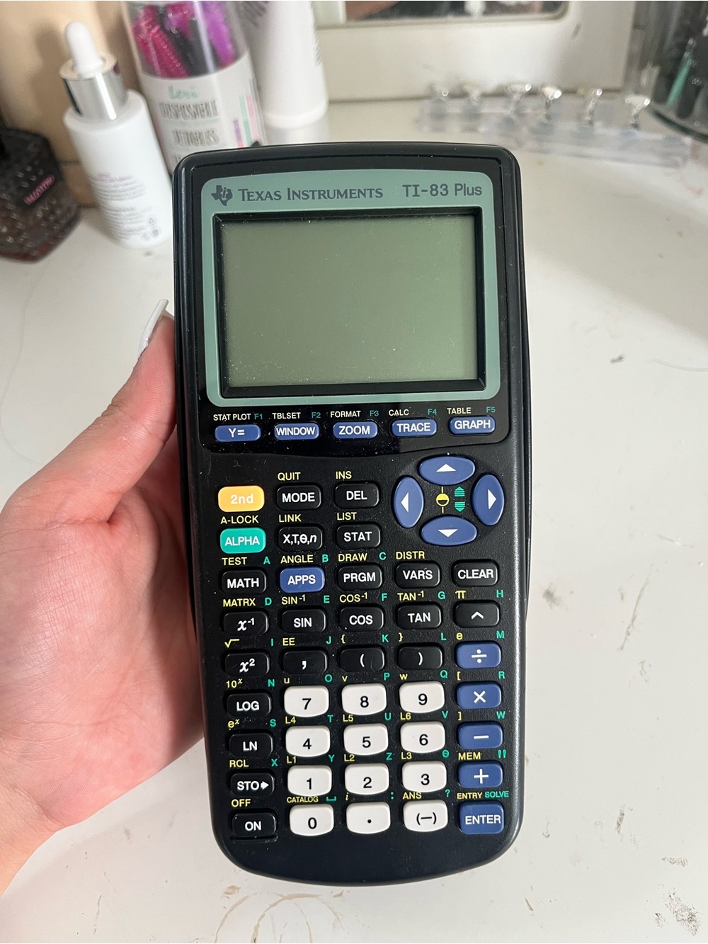 Texas Instruments TI-83 Plus Graphing Calculator — Black with Blue/Green Keys